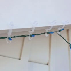 Simple Living Set Of 25 Clear Max Pro Anywhere Christmas Light Clips - 4" 12 Simple Living Set Of 25 Clear Max Pro Anywhere Christmas Light Clips - 4" -Northlight Shop 3458793192131781280