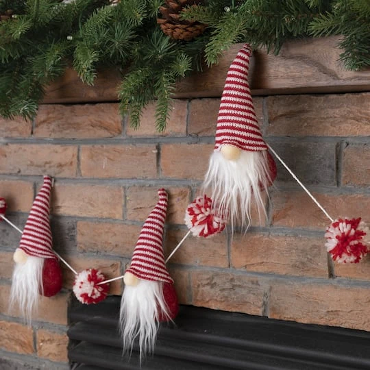 Glitzhome® 6ft. Red & White Fabric Christmas Gnome Garland 6 Glitzhome® 6ft. Red & White Fabric Christmas Gnome Garland - Image 4
