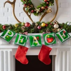 Impact 4.5ft. Shimmering Green Lighted Peace Garland -Northlight Shop D491001S 3