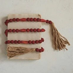 Hello Honey® 6ft. Burgundy Paulownia Wood Beads & Jute Tassels Garland -Northlight Shop D822090S 2